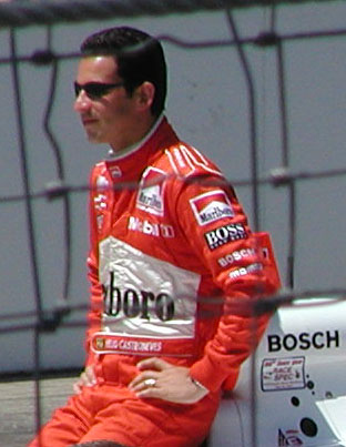 helio posing on car